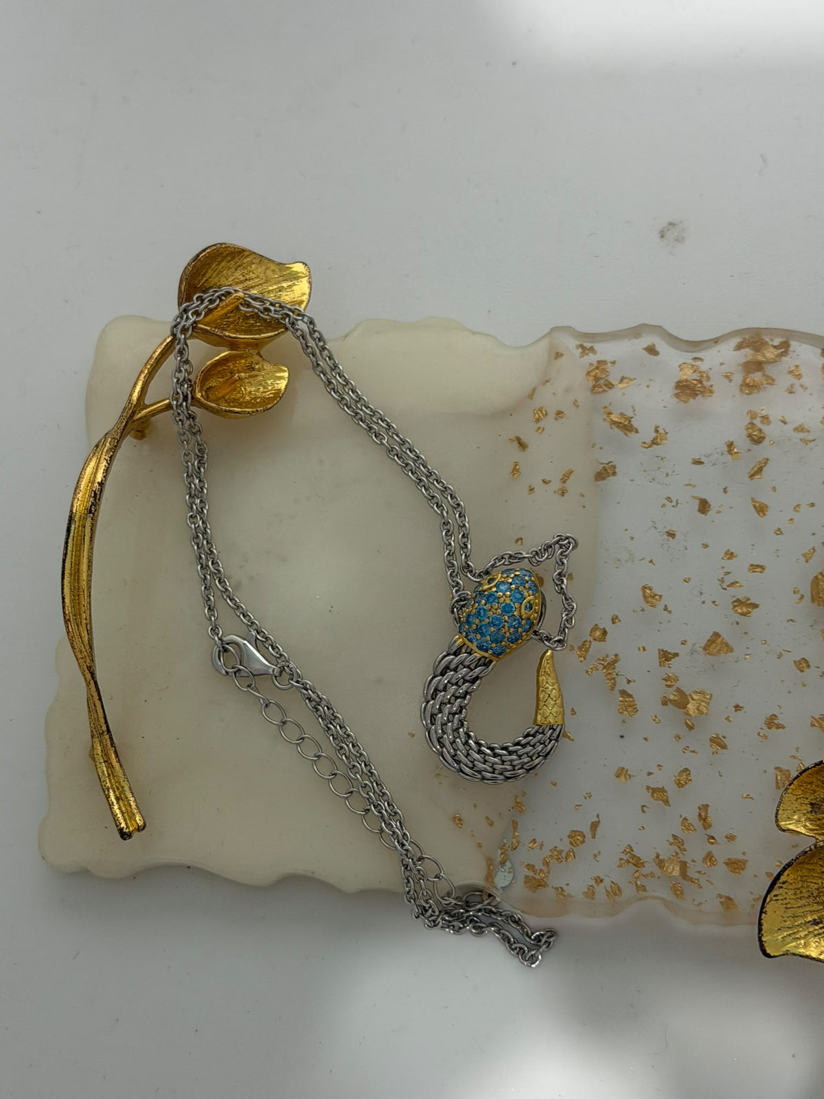 Collana in argento 925 con serpente e topazio azzurro