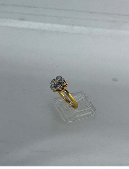 Anello fiore girevole con pietre bianche in argento 925 bagnato oro