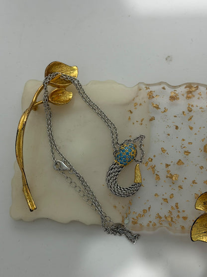 Collana in argento 925 con serpente e topazio azzurro